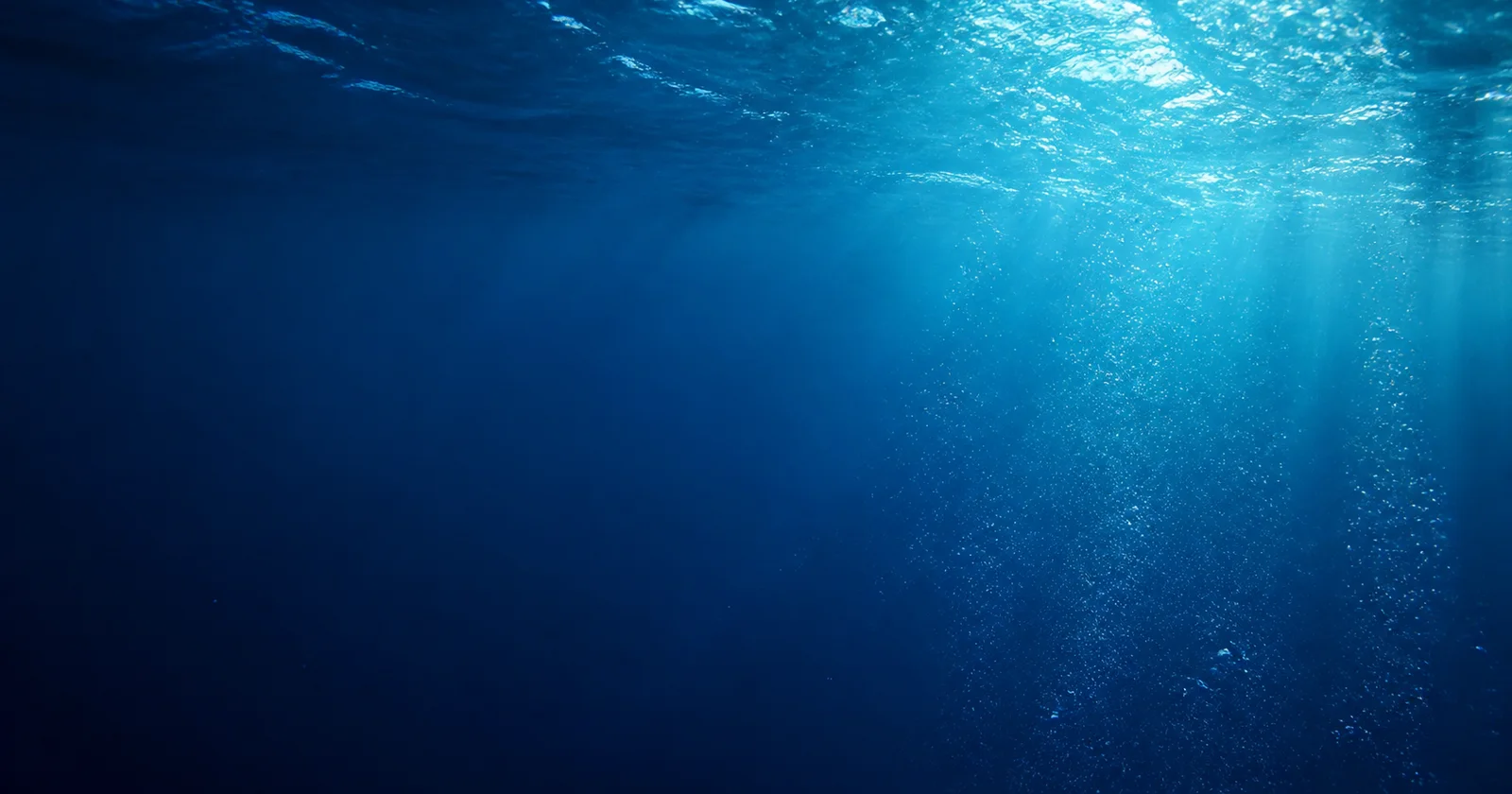 Sunlight passing through a clear blue water column