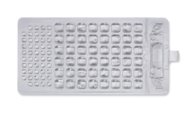 An IDEXX Quanti-Tray with 48 large and 48 small wells before incubation